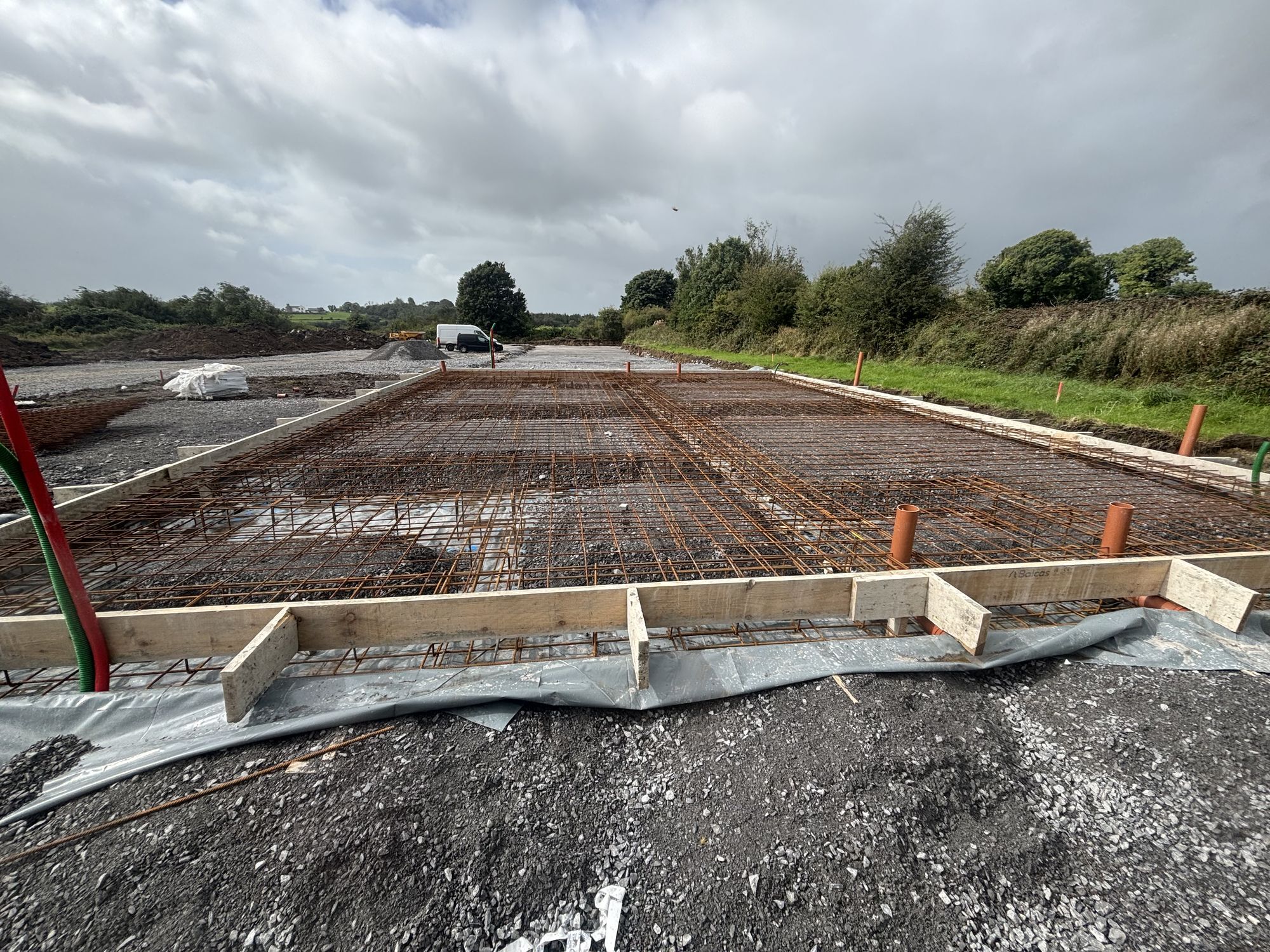 Steel reinforcement mesh and timber formwork laid for a concrete slab