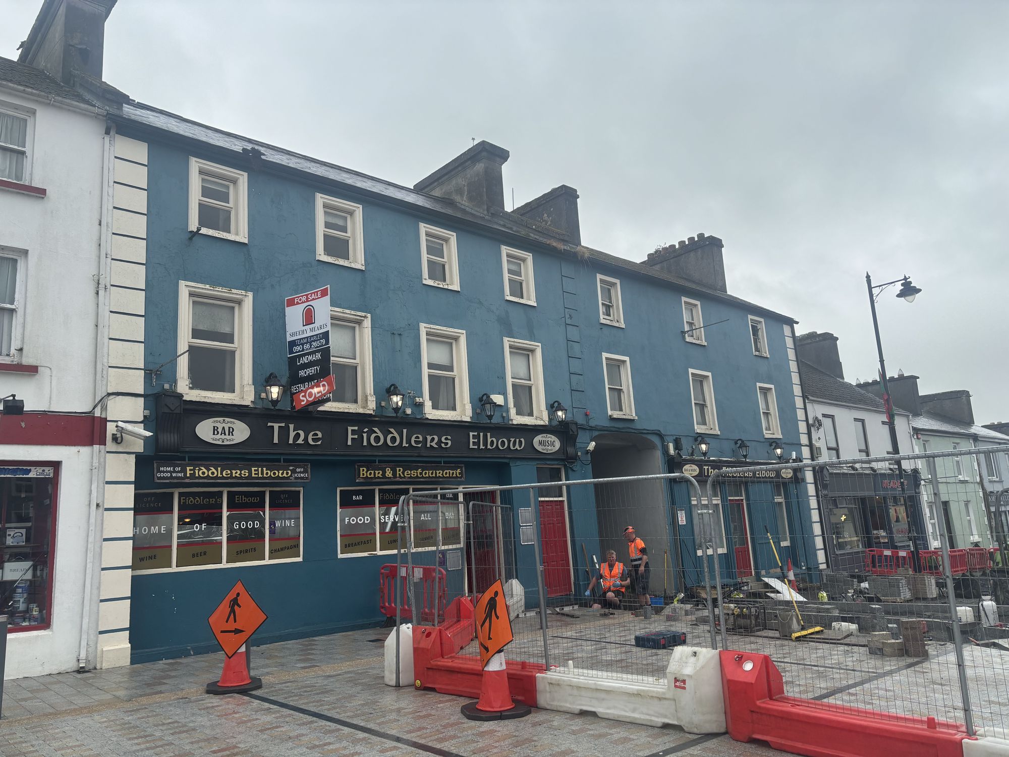 Refurbished commercial building with a blue facade